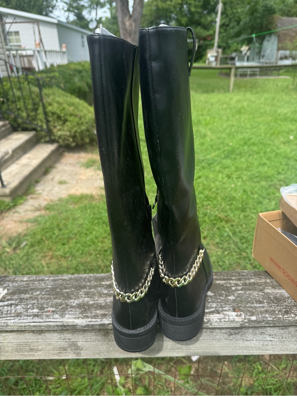 Black Knee-High Heeled Boots with Gold Chain Detail
